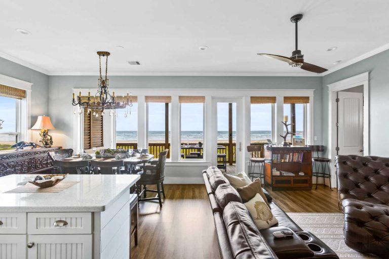 beach vacation rental in galveston, texas. living room with views of the beach.